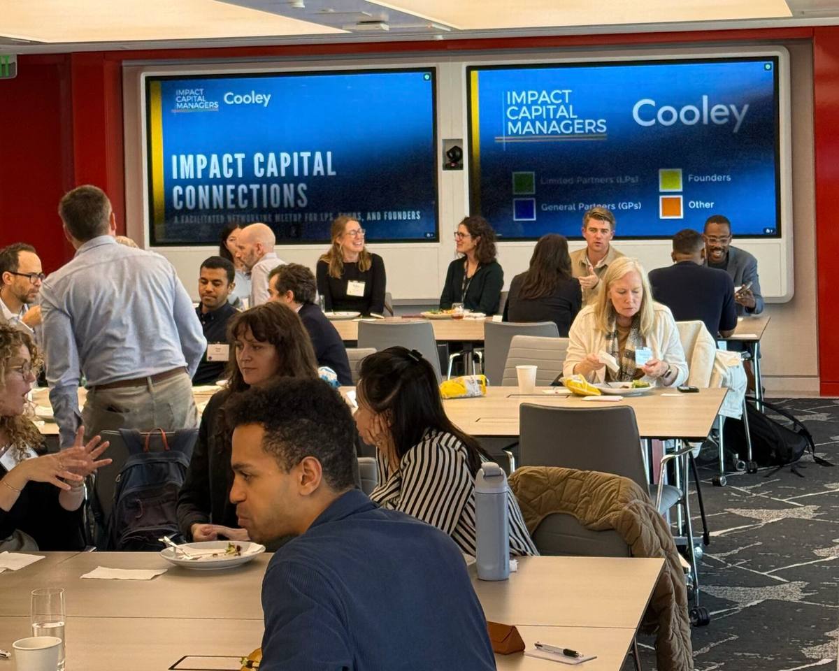 Founders and investors talking over lunch at a past impact networking event in San Francisco